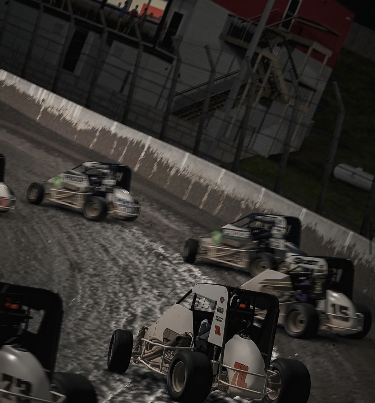 Midgets battling through a dirt corner